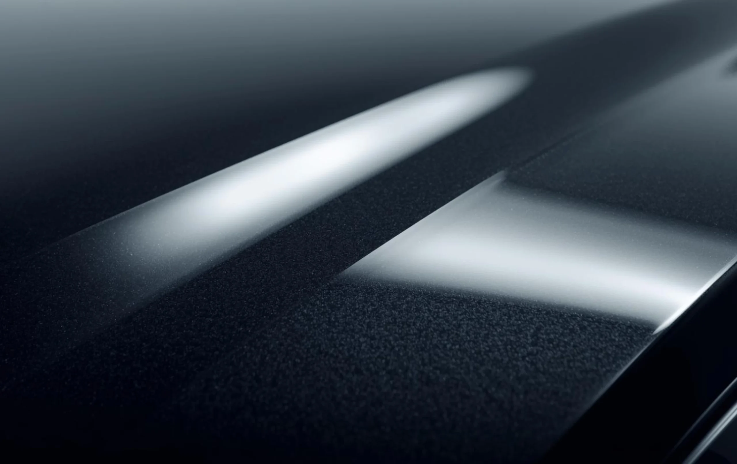 Close-up of matte paint protection film texture on car body panel